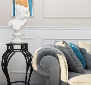 Stylish interior featuring a classical bust sculpture and elegant contemporary furniture.